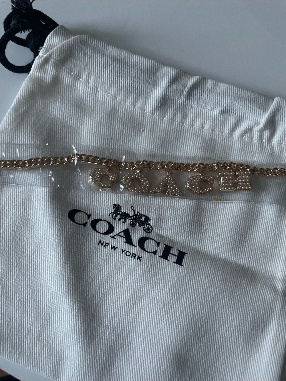 Coach Gold-Tone Logo Chain bracelet. New in plastic wrapping & bag
